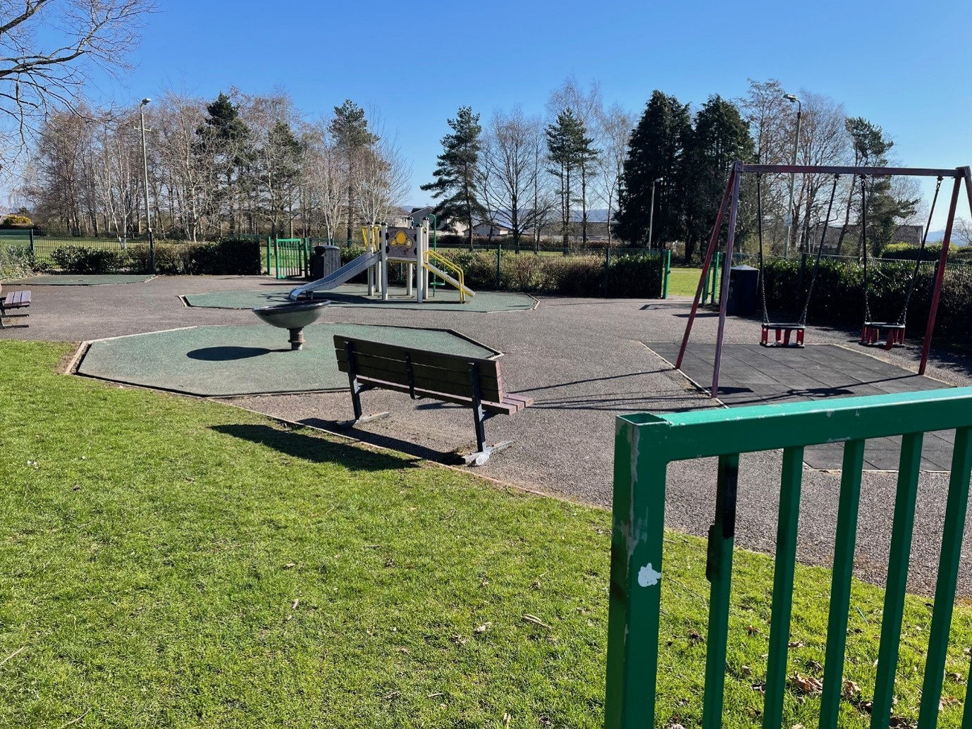 Photo of Muirend Park play area showing play equipment and benches